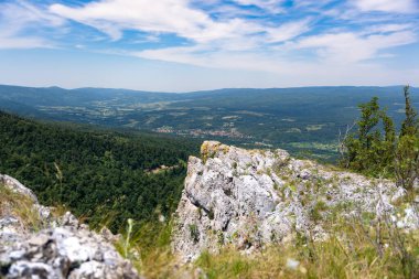 Details of the nature and natural state of the Rtanj mountain in eastern Serbia. Rtanj mountain, also known as the Serbian pyramid with rocks and vegetation. North hiking side with view clipart