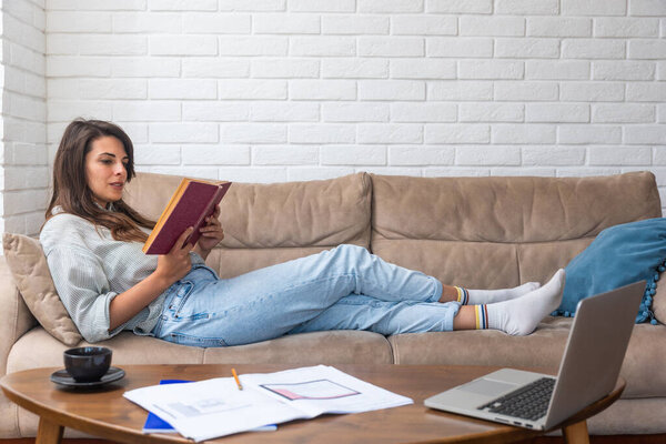 Young intelligent innovative architect businesswoman having issue with concentration and motivation, no ideas and creativity. Creative freelance architectural university student sitting at home.