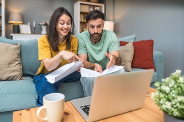 Successful young business people working together in home office. Freelance couple teamwork businessman and businesswoman startup concept video call presentation on laptop computer and webcam