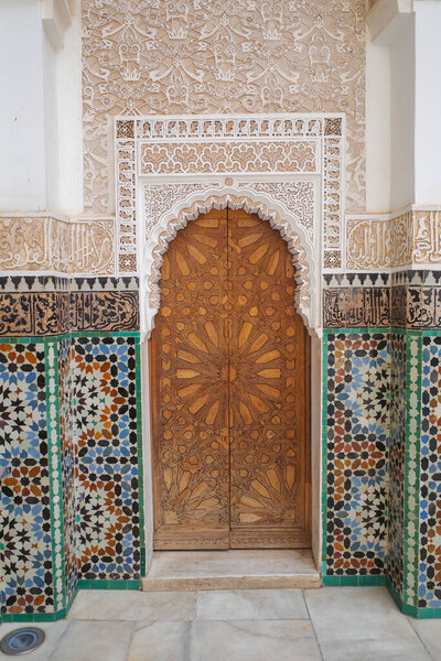 Marrakech, Morocco - Feb 10, 2023: Beautiful handicraft work inside the koranic school Medersa Ben Youssef in Marrakech