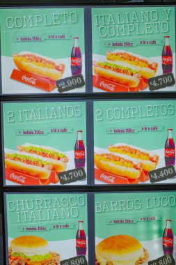 Santiago, Chile - 26 Nov, 2023: Traditional Completo Hot Dogs on sale at a snack vendor in Santiagos Plaza de Armas clipart