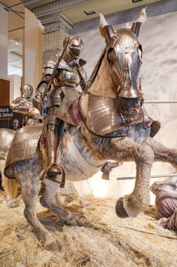 Leeds, UK - 24 Feb, 2024: Medieval weaponry and battle armour on display at the Royal Armories Museum clipart