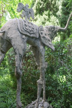 Girona, Spain - 26 May, 2024: Salvador Dali's statue of an Elephant in the gardens of the Gala Dali Castle in Pubol, Catalonia clipart