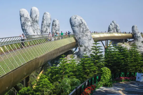 stock image Ba Na Hills, Vietnam - 7 Feb, 2024: The Golden Bridge, a tourist attraction at the SunWorld resort in the Truong Son Mountains, Da Nang