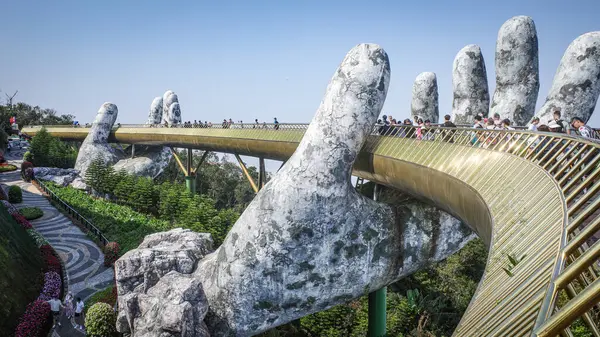 stock image Ba Na Hills, Vietnam - 7 Feb, 2024: The Golden Bridge, a tourist attraction at the SunWorld resort in the Truong Son Mountains, Da Nang