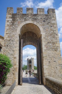 Girona, Spain - 7 July, 2024: Gate tower at the entrance to Pont Vell, in the medieval village of Besalu, Catalonia clipart