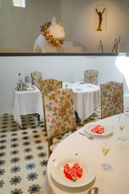 Roses, Spain - 20 July, 2024: Dining room at the El Bulli 1846 restaurant museum, Cala Montjoi, Costa Brava clipart