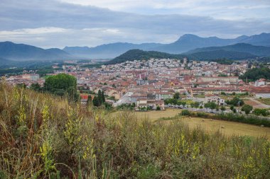 Olot, Spain - 7 Aug, 2024: View from Montsacopa Volcano over the town of Olot, Garrotxa, Catalonia clipart