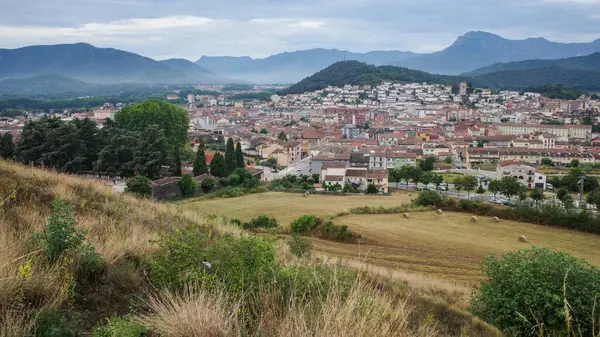 stock image Olot, Spain - 7 Aug, 2024: View from Montsacopa Volcano over the town of Olot, Garrotxa, Catalonia