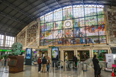 Bilbao, Spain - 16 Dec, 2024: Colourful stained glass window in the grand arrivals hall of the Abando train station in Bilbao clipart