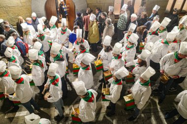 San Sebastian, Spain - 20 Jan 2025: Drummers in chef uniforms at the Tamborrada in San Sebastian clipart