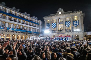 San Sebastian, Spain - 19 Jan 2025: Crowds in the Plaza Constitucion for the Tamborrada and day of Saint Sebastian clipart