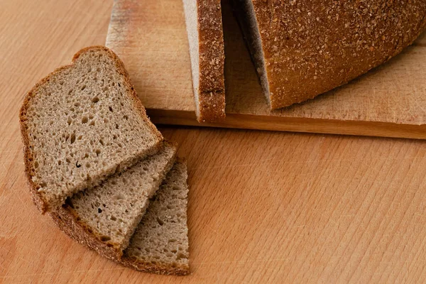 stock image Sliced rye bread on a wooden board