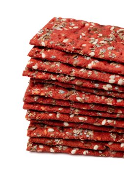 Stack of Beetroot dietic crunchy crispbreads on white background clipart