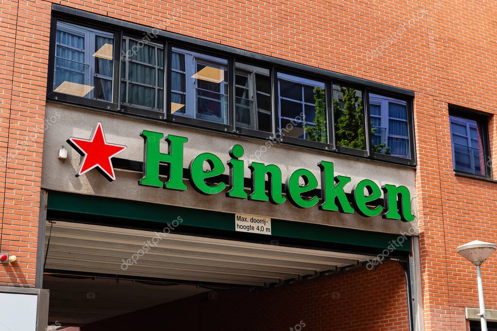 Amsterdam, Netherlands  May 21, 2025: Heineken logo displayed on the entrance facade of a brick commercial building. Heineken is one of the worlds most famous beer brands.
