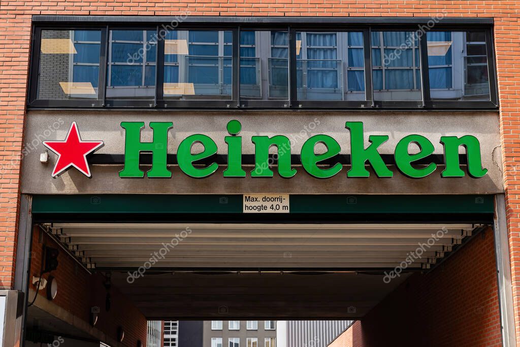 Amsterdam, Netherlands  May 21, 2025: Heineken logo displayed on the entrance facade of a brick commercial building. Heineken is one of the worlds most famous beer brands.