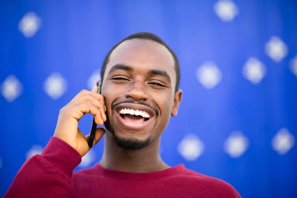 Closeup Portrait Cheerful African Man Talking Mobile Phone Laughing Blue — Stock Photo, Image