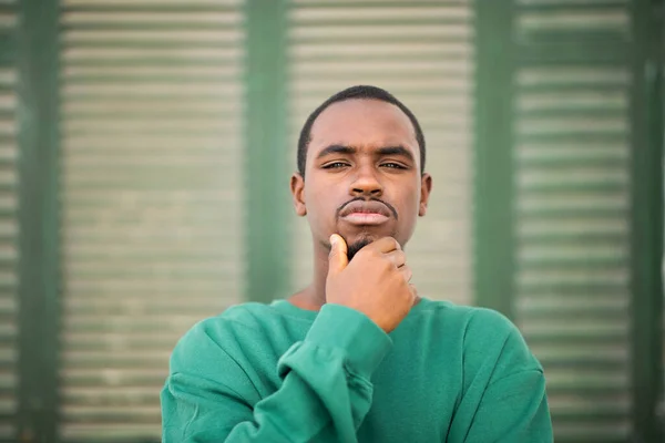 Close Portrait Thoughtful Young African Man Green Shirt Staring Camera — ストック写真