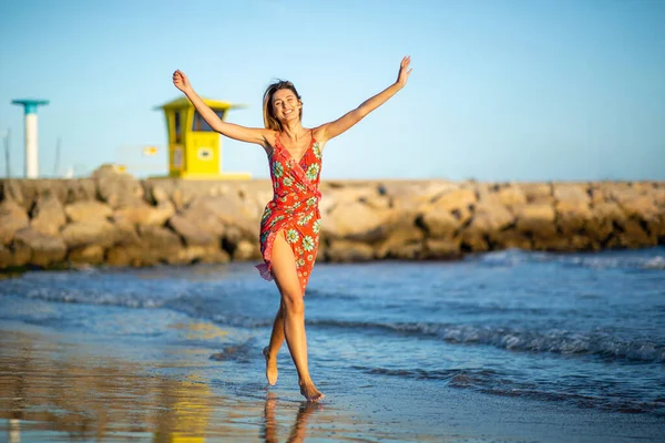 Full Length Portrait Carefree Young Woman Running Arms Raised Beach — Stock Photo, Image