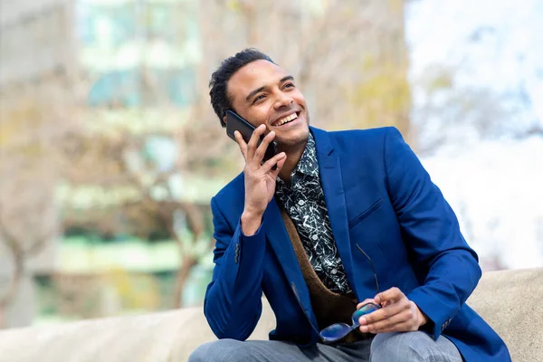 Portrait Smiling Young Mixed Race Businessman Sitting Looking Away Talking — Stock Photo, Image