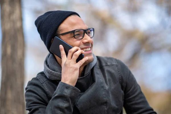 Close Portrait Young African Man Talking Mobile Phone Sitting Winter — Stock Photo, Image