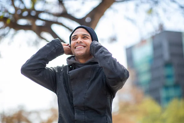 Portrait Happy Young Man Black Jacket Wearing Knitted Hat Looking — Stock Photo, Image