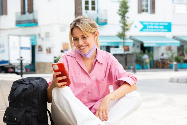 Portrait Happy Woman Sitting Mask Looking Mobile Phone Smiling — Stock Photo, Image