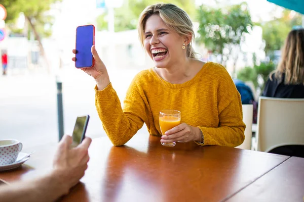 Portrait Cheerful Young Woman Sitting Cafe Drink Showing Her Cellphone — Stock Photo, Image