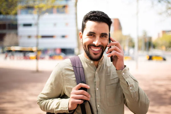 Portrait Smiling Young Arabic Man Talking Mobile Phone Walking City — Stock Photo, Image