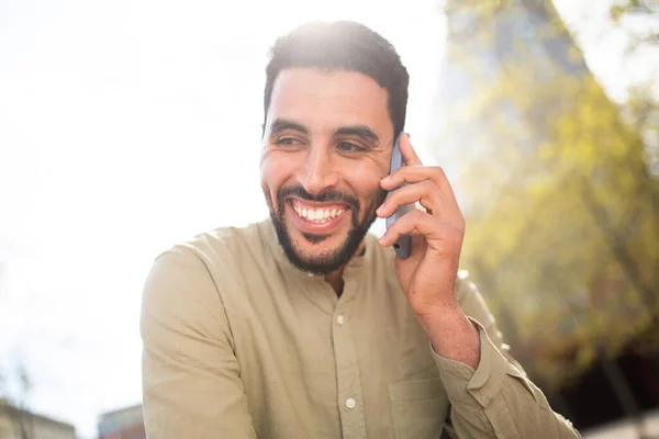 Close Portrait Smiling Young Arabic Man Talking Cell Phone Sunny — Stock Photo, Image