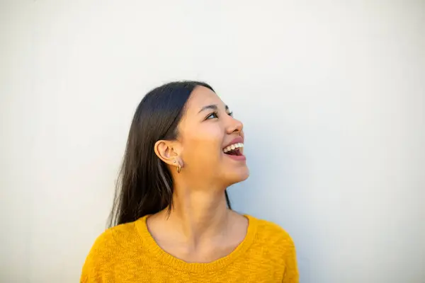 stock image Close up portrait young woman laughing and looking away by white background