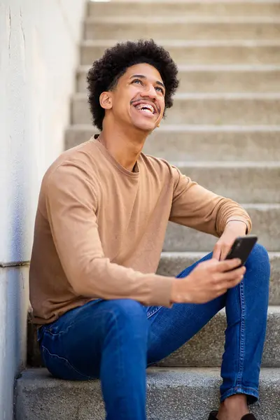 Portrait Happy Young Hispanic Man Sit Stairs Smart Phone — Stok Foto