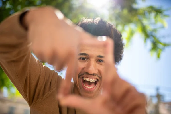 Close Portrait Smile African American Man Framing Hands — Stok Foto