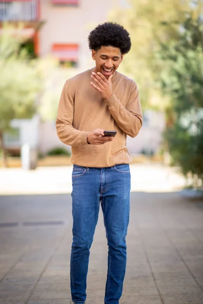 Portrait Happy Young Man Laughing Mobile Phone — Stok Foto
