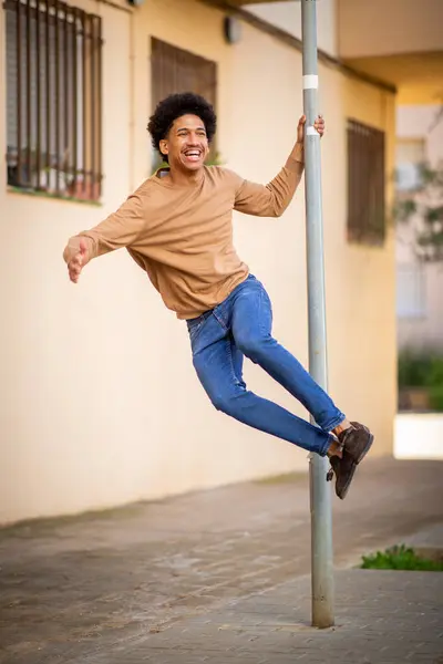 Portrait Happy Man Holding Pole Outdoor Jumping Joy — Stok Foto
