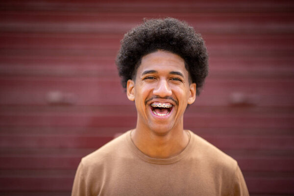 Close Portrait Happy Hispanic Young Man Laughing Braces Stock Image