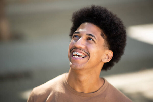 Carefree Hispanic Man Enjoys Moment Relaxation Outdoors Stock Photo