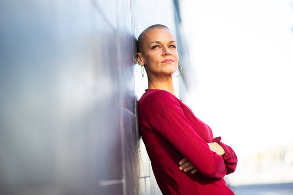 Side Portrait Woman Shaved Hair Leaning Wall Royalty Free Stock Photos