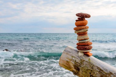 Detail of a zen monolith for relaxation on a beach for