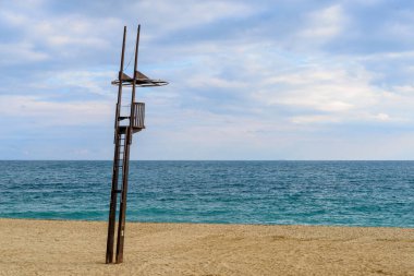 General view of a beach with a watchtower of a lifeguard