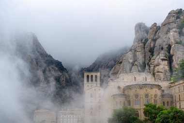 Mystical Fog: Exploring Montserrat Monastery on a Misty Day clipart
