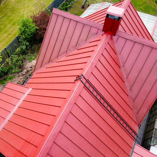 Red Metal Roof. Classic Design. Standing Seam Red Roof