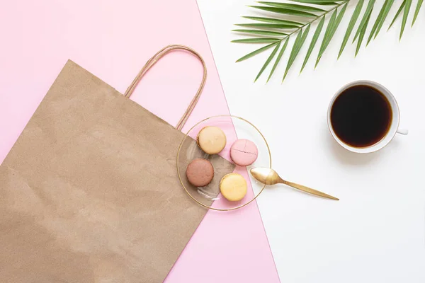 stock image Flat Lay shopping concept with paper bag and tropical leaves. Elegant composition with elegant accessories