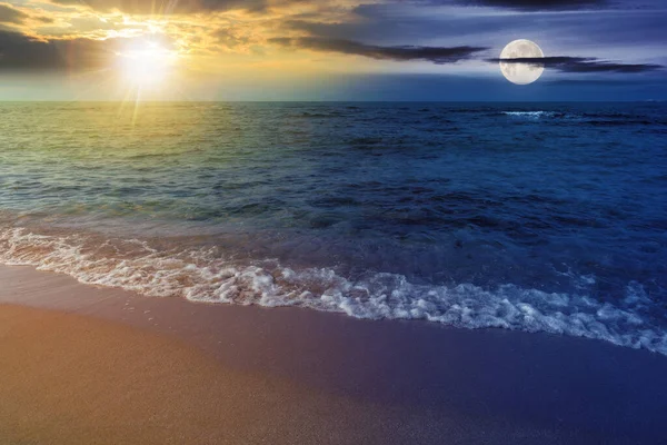 summer vacation background at the sea with sun and moon. day and night time change concept. clear water and sandy beach at twilight. relax and recreation season