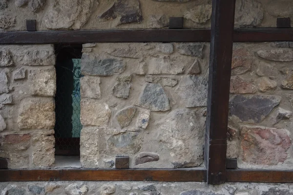 medieval windows on the stone wall. traditional old balkan architecture