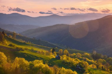 stunning sunset over the rural mountain valley. carpathian countryside scenery in spring