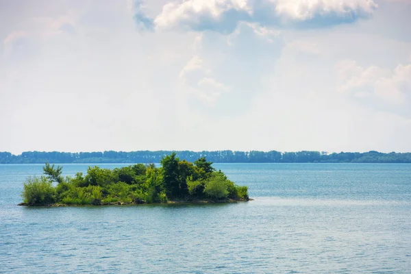 stock image island on strbske pleso water reserve. tranquil nature background. calm summer weather