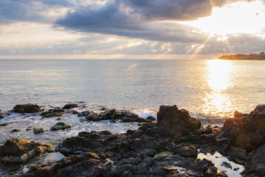 black sea scenery at sunrise. bright cloudy sky. leisure background