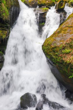 waterfall among the rocks. nature background in spring