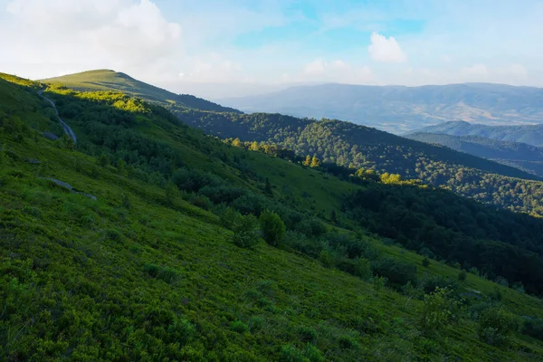 stock image mountainous nature background. summer scenery in morning light. rolling landscape of runa mountain with grassy slopes